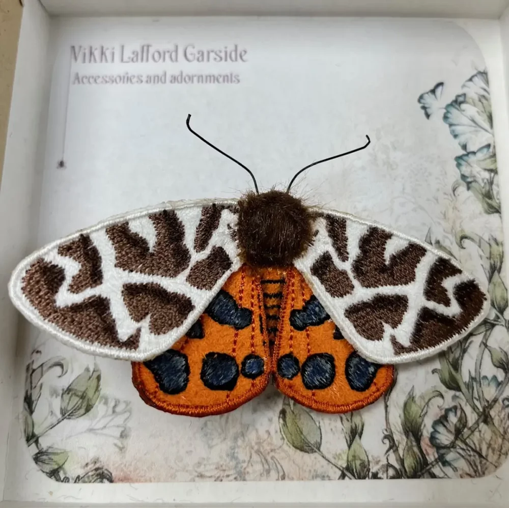 Tiger moth brooch