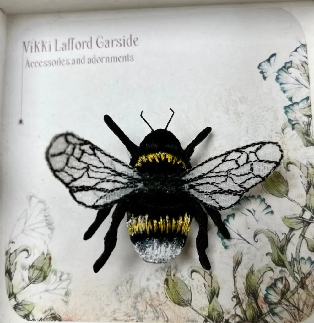 White tailed bee brooch